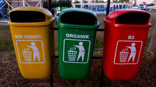 istock Colorful plastic trash cans for different types of trash 1418856504
