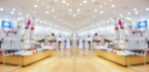Abstract blur clothing boutique display interior of shopping mall background stock photo