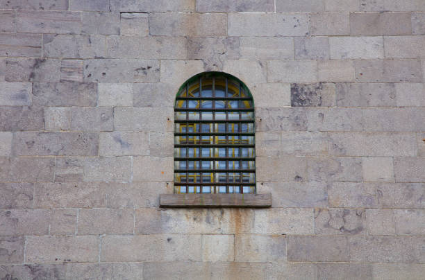 jail window stone wall prison criminal incarceration crime lock crime lockup jail window stone wall criminal incarceration building prison dungeon medieval prison prison cell stock pictures, royalty-free photos & images