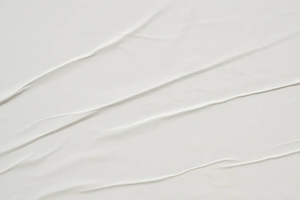 istock white crumpled and creased paper poster texture background 1418880494