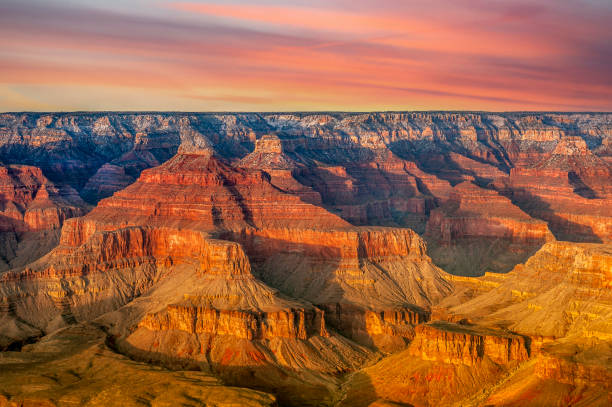 A view of the rugged yet beautiful Grand Canyon national park during a bright day shows the intricate details of the ridges and formations.
