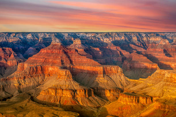Sunset at Grand Canyon A view of the rugged yet beautiful Grand Canyon national park during a bright day shows the intricate details of the ridges and formations. south rim stock pictures, royalty-free photos & images