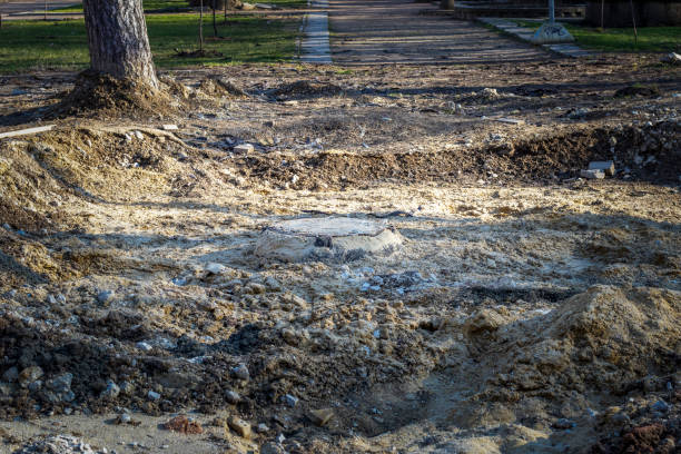istock Old sewer well unearthed on path in park. 1418884082