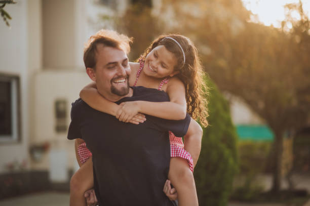 istock father and daughter playing outdoors 1418887298