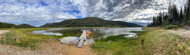 Panoramic photo of floating dock for paddleboats and fishing craft on Navajo Lake near Duck Creek Utah stock photo