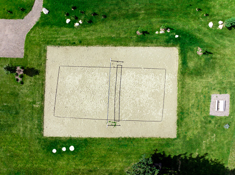 Overhead aerial view of a beach volleyball court