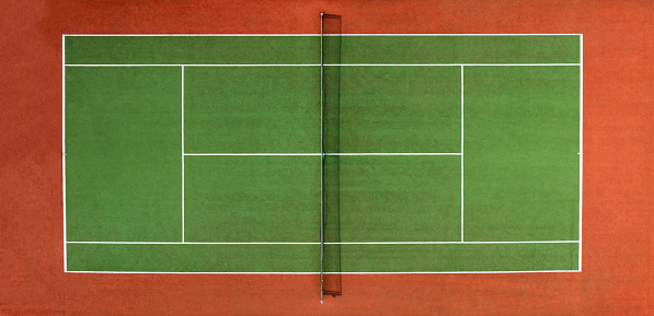 Overhead aerial view of a synthetic tennis court