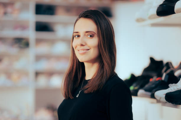istock Beautiful Shop Assistant Working in a Shoes Store 1418902153
