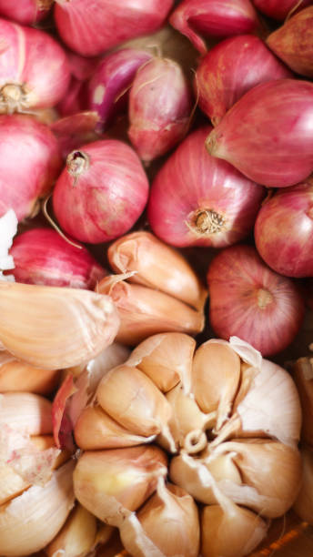istock collection of onions and garlic 1418906890