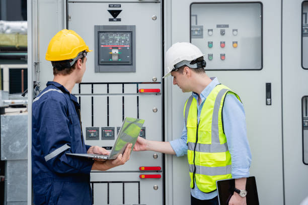 istock A team of engineers examined the electrical switchboard while checking the operational voltage range. 1418907605