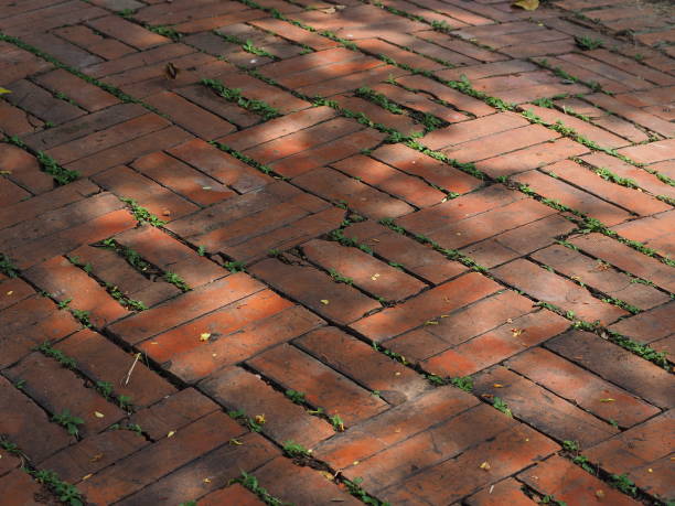 istock Red-brown brick floor and white light orange 1418907651