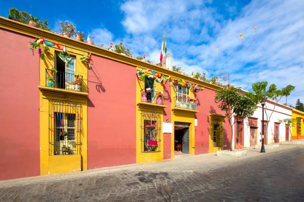 Oaxaca, Mexico, Scenic old city streets and colorful colonial buildings in historic city center Oaxaca, Mexico, Scenic old city streets and colorful colonial buildings in historic city center. mexico street scene stock pictures, royalty-free photos & images