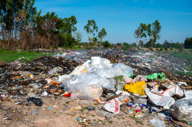 istock Garbage pollution from small towns Incinerated and disposed of incorrectly A source of pollution And spread the disease.Smoke of burning garbage into the air- pollution from waste garbage . 1418919675