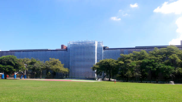 istock High-rise buildings under construction that use a protective canvas around the building for good environment and hygiene of the community. 1418922021