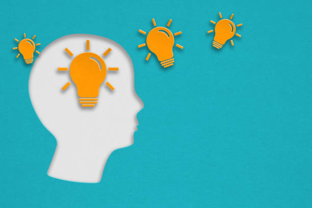 istock for thinking mind, smart idea, brainstorming concept, yellow lightbulb and human head paper cut with grunge green background 1418922078