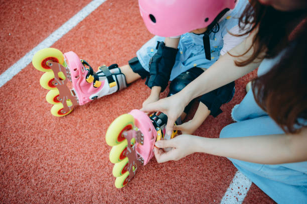 istock Girl Putting on Inline Skates 1418922086