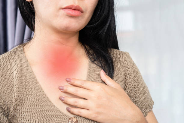 istock Asian woman have problem with acid reflux feeling sore in her throat 1418922135