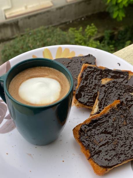 istock Delicious chocolate mocha coffee with latte art and chocolate toasted bread 1418929573