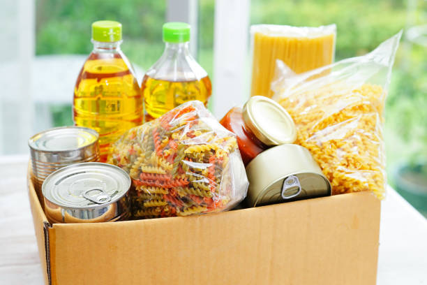 istock Foodstuffs in donation box for volunteer. 1418932938