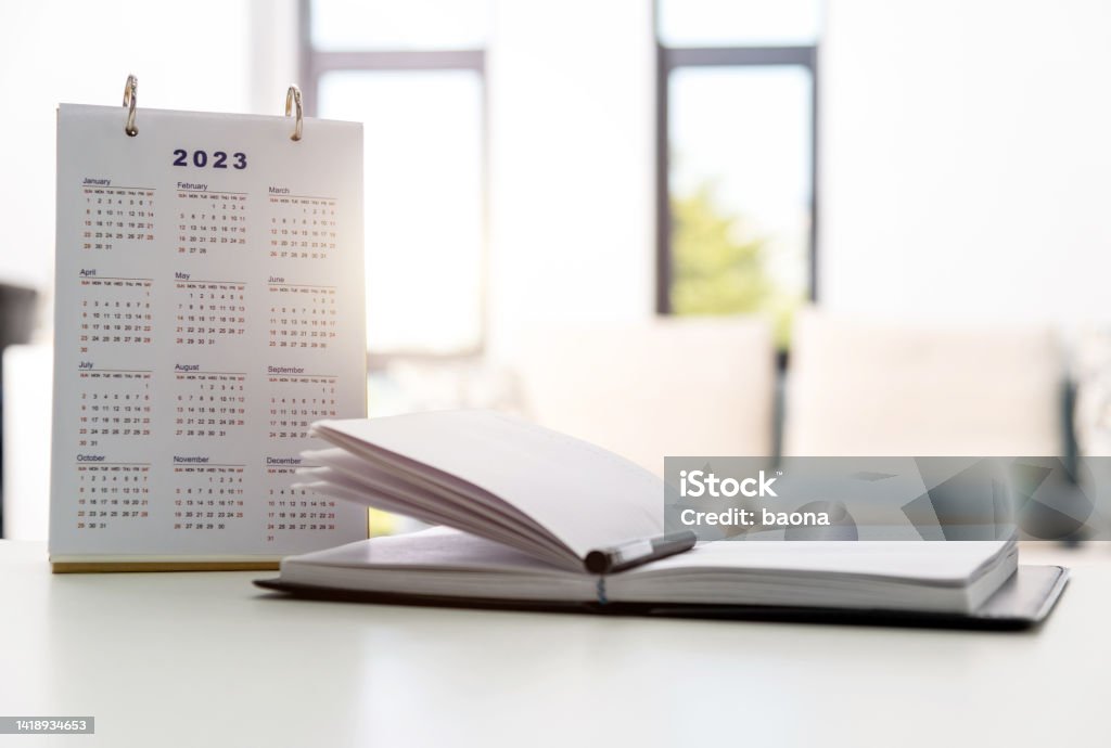 2023 calendar and note pad on the desk 2023 calendar and note pad on the desk. Calendar Stock Photo