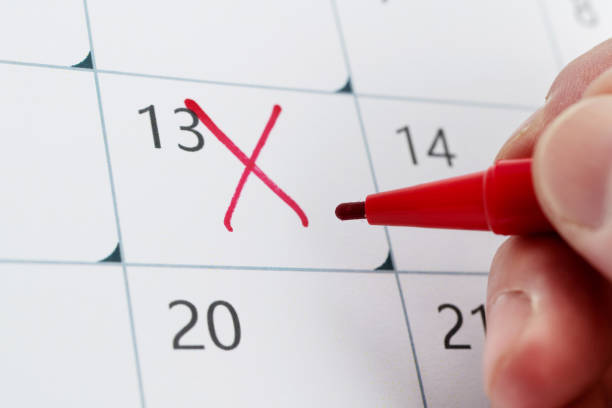 istock Calendar number 13 with cross shape 1418935235