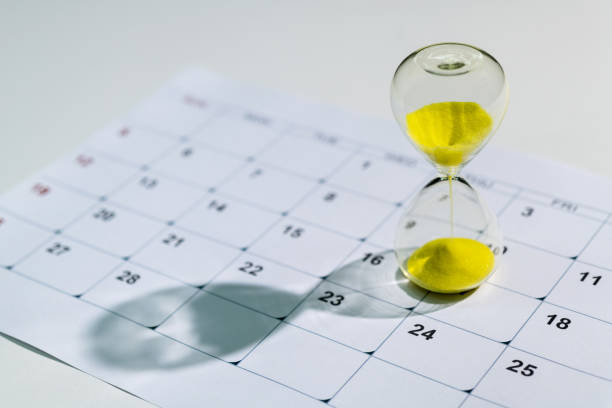 istock Calendar and hourglass on the table 1418935278