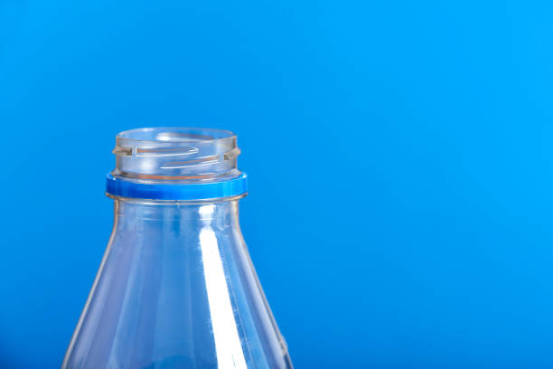 istock Plastic disposable bottle, blue background. Sustainability, recycling, pollution 1418936597