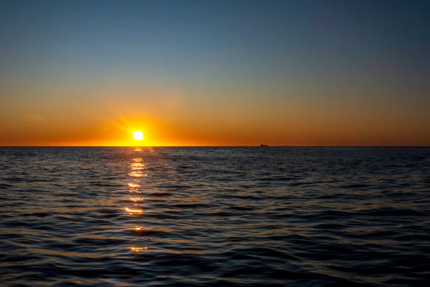 istock Amazing sunset on the Atlantic Ocean. The sun reflected in the waves 1418936718