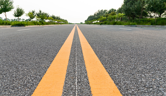 Double yellow line in the middle of the road.