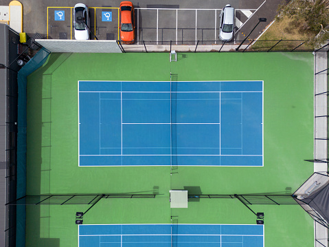 Aerial view of tennis courts in typical Australian suburb