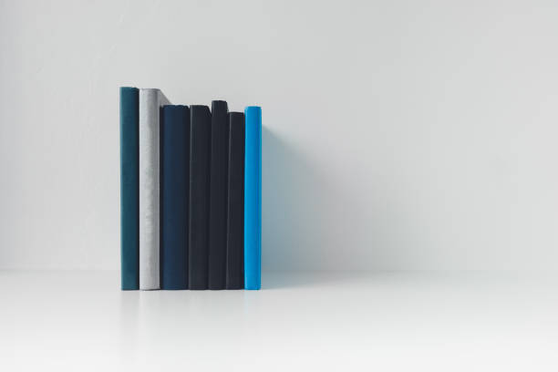 istock Book or textbook stack with copy space. Businessperson working or student reading and writingI. Idea of success in business learning course or education studying. 1418944434