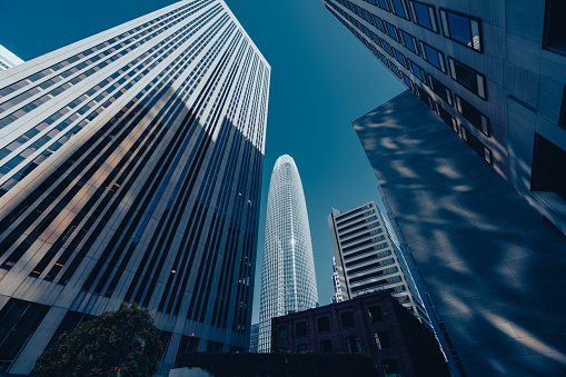 Skyscrapers in the financial district of San Francisco, California, USA, seen from low angle upwards during daytime.
