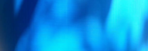 istock Tarp, shaded blue tarp. Background of strong, flexible, waterproof material. Canvas or polyester coated with polyurethane. Polyethylene, plastic. tree shadow on blue background 1418954846