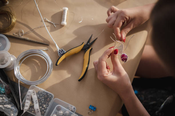 istock Making a DIY necklace from silver wire and crystal 1418954940