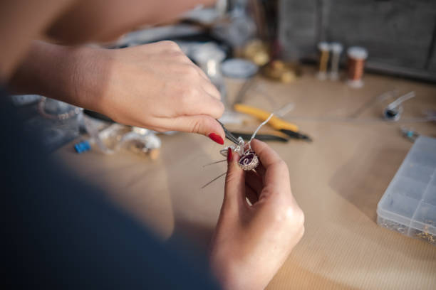 istock Making a DIY necklace from silver wire and crystal 1418955121