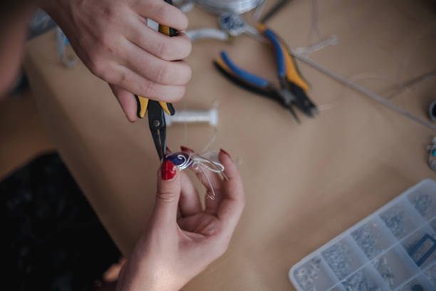 istock Making a DIY necklace from silver wire and crystal 1418955123