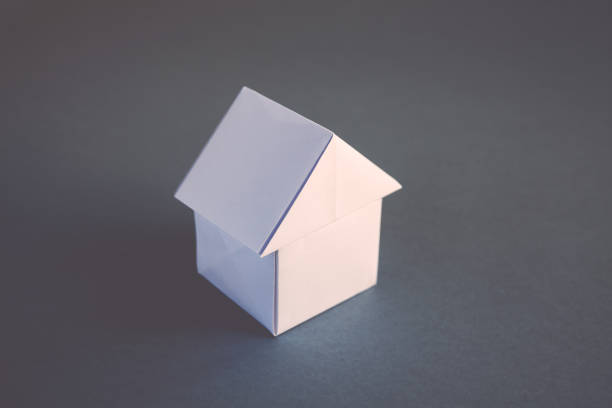 istock White paper house origami isolated on a grey background 1418955168