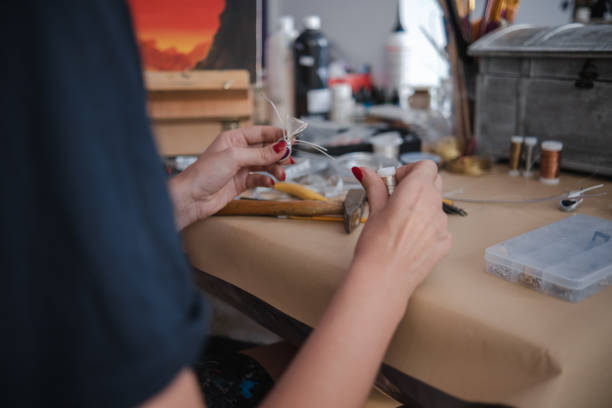 istock Making a DIY necklace from silver wire and crystal 1418955174