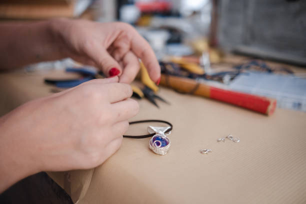 istock Making a DIY necklace from silver wire and crystal 1418955415