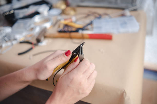 istock Making a DIY necklace from silver wire and crystal 1418955419
