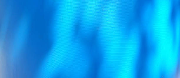 istock Tarp, shaded blue tarp. Background of strong, flexible, waterproof material. Canvas or polyester coated with polyurethane. Polyethylene, plastic. tree shadow on blue background 1418959863