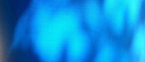 istock Tarp, shaded blue tarp. Background of strong, flexible, waterproof material. Canvas or polyester coated with polyurethane. Polyethylene, plastic. tree shadow on blue background 1418960714
