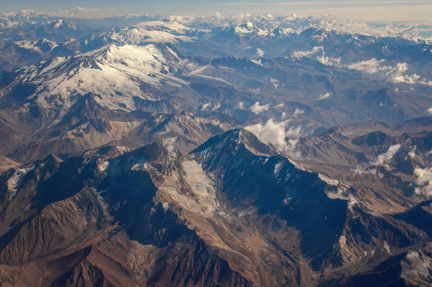 aerial view of snowy mountains - Chile mountains Andes Mountains (Cordillera de los Andes) viewed from an airplane window, near Santiago, Chile. andes stock pictures, royalty-free photos & images