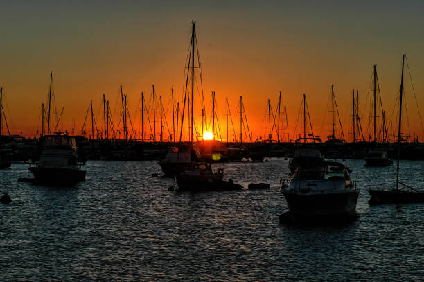 istock Yacht masts and rigging in silhouette at sunset 1418964003