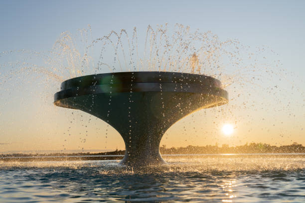 istock Fountain in operation spraying water against sky 1418965395