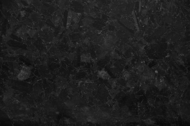istock Black marble stone as a background close up, black background 1418965676