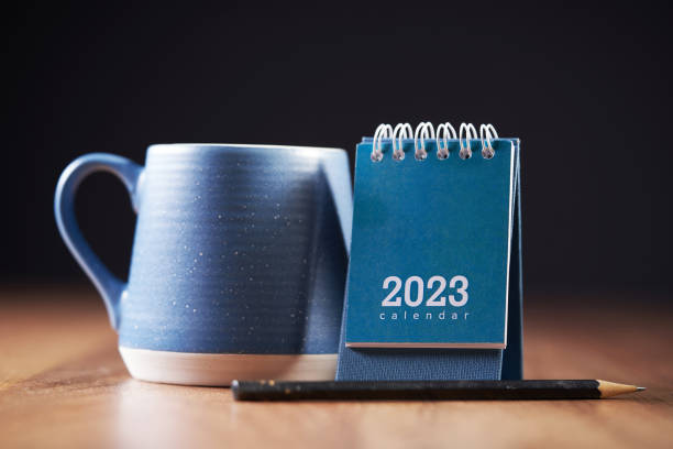 istock 2023 diary with cup of cup on table top 1418965877