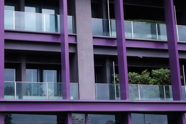 Modern urban apartment building exterior in evening.