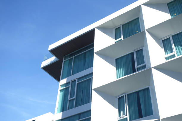 istock Modern urban apartment building exterior in evening. 1418967195