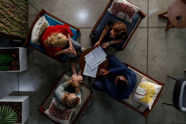 istock Professional partners discussing agreement terms in meeting 1418967644